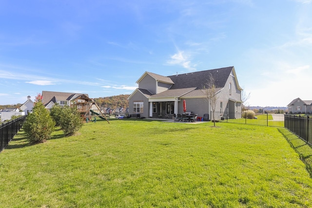 6575 Windmill Dr, College Grove, TN 37046 - back of property with a playground, a patio area, and roof with shingles