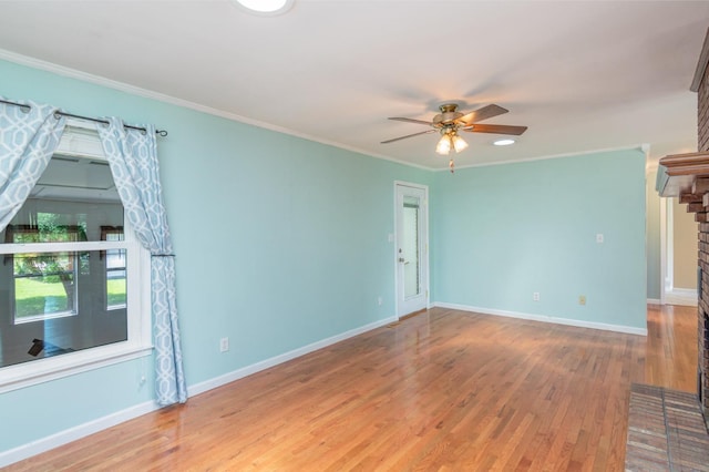 930 Rossview Rd, Clarksville, TN 37043 - empty room with ceiling fan, a fireplace, wood finished floors, and ornamental molding