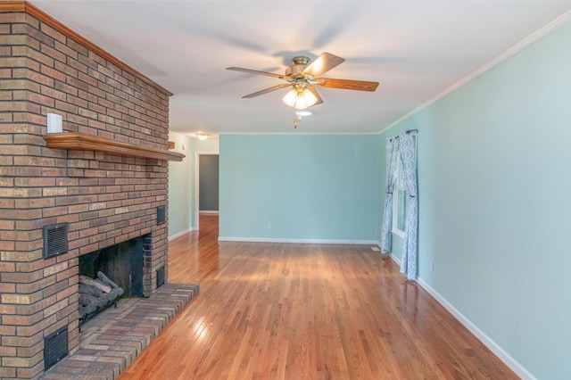 930 Rossview Rd, Clarksville, TN 37043 - unfurnished living room with ceiling fan, wood finished floors, a fireplace, and ornamental molding