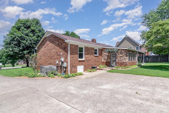 930 Rossview Rd, Clarksville, TN 37043 - rear view of property featuring a chimney and brick siding