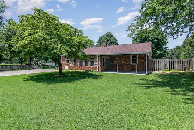930 Rossview Rd, Clarksville, TN 37043 - view of front of home with a patio, a chimney, and brick siding