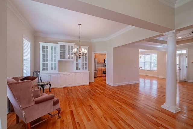 107 Hunters Ct, Tullahoma, TN 37388 - sitting room featuring ornate columns, ornamental molding, light wood finished floors, and a chandelier