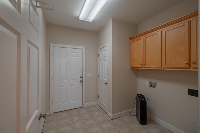 107 Hunters Ct, Tullahoma, TN 37388 - washroom featuring washer hookup, cabinet space, and light tile patterned floors