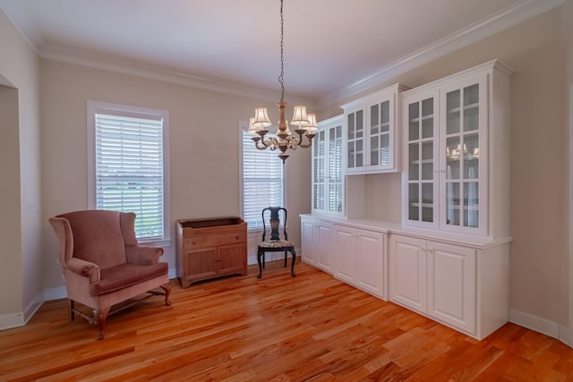 107 Hunters Ct, Tullahoma, TN 37388 - sitting room with a chandelier, light wood finished floors, and ornamental molding