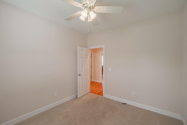 107 Hunters Ct, Tullahoma, TN 37388 - spare room featuring light colored carpet and a ceiling fan