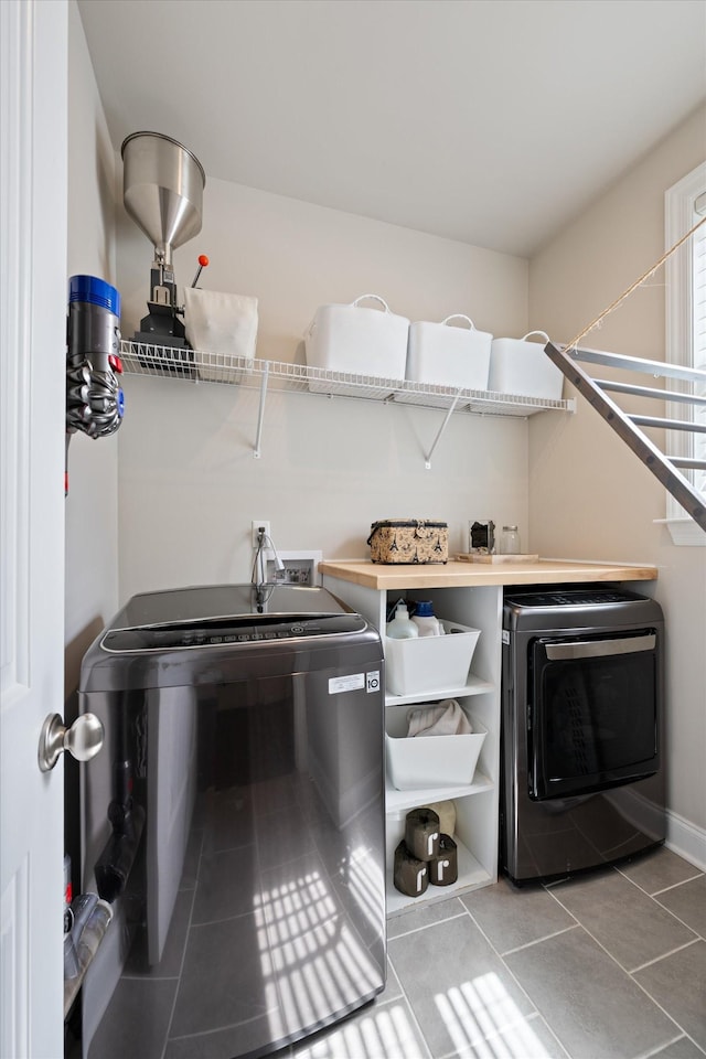 3204 Vinemont Dr, Thompsons Station, TN 37179 - laundry room with separate washer and dryer and tile patterned flooring