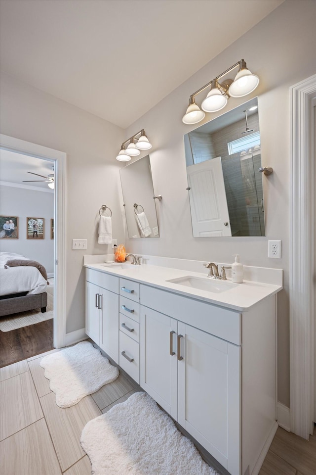 3204 Vinemont Dr, Thompsons Station, TN 37179 - ensuite bathroom with double vanity, baseboards, a shower, and wood finished floors