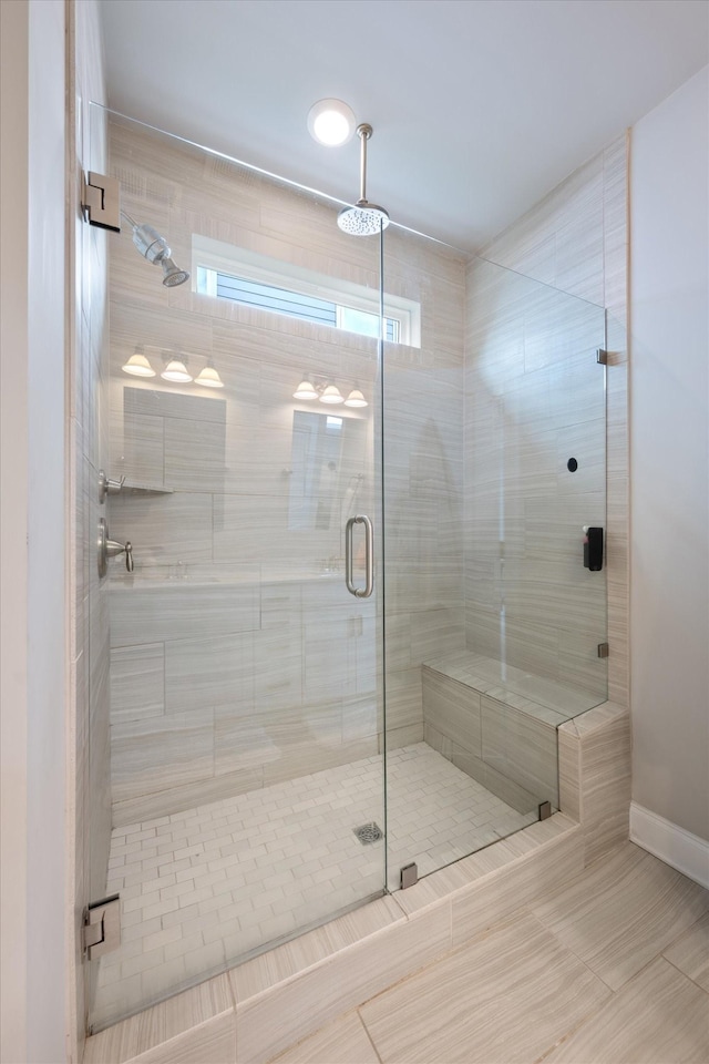 3204 Vinemont Dr, Thompsons Station, TN 37179 - bathroom featuring a stall shower, tile patterned floors, and baseboards