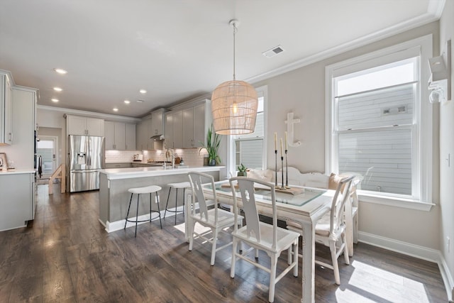 3204 Vinemont Dr, Thompsons Station, TN 37179 - dining space with crown molding, dark wood-type flooring, recessed lighting, and baseboards