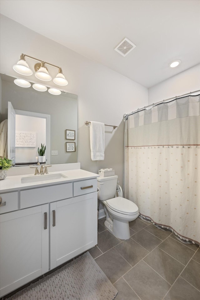 3204 Vinemont Dr, Thompsons Station, TN 37179 - bathroom featuring vanity, toilet, tile patterned flooring, a shower with shower curtain, and recessed lighting