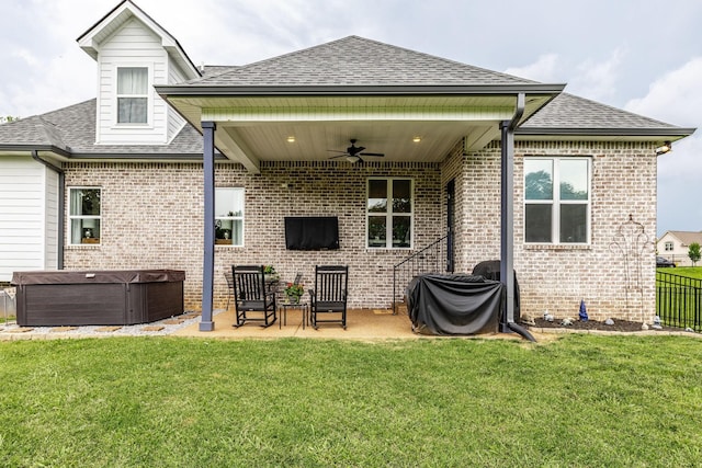403 Hunter Bryce Ln, Lebanon, TN 37087 - rear view of house featuring a hot tub, ceiling fan, a shingled roof, a patio, and brick siding
