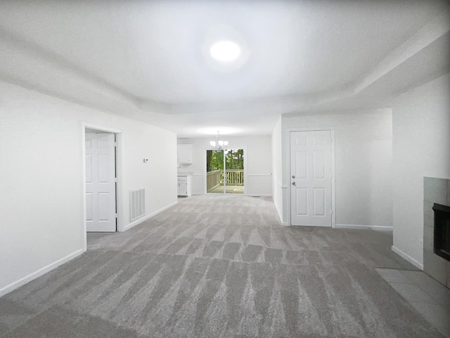 108 Nancy Ave, Pleasant View, TN 37146 - unfurnished living room with a chandelier, carpet, and baseboards