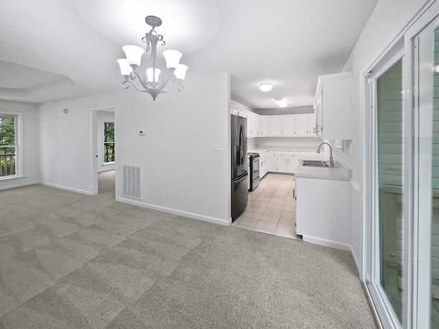 108 Nancy Ave, Pleasant View, TN 37146 - kitchen featuring a sink, stainless steel appliances, healthy amount of natural light, and a chandelier