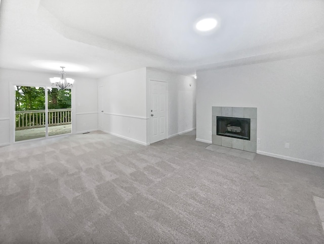 108 Nancy Ave, Pleasant View, TN 37146 - unfurnished living room featuring a chandelier, carpet floors, a fireplace, and baseboards