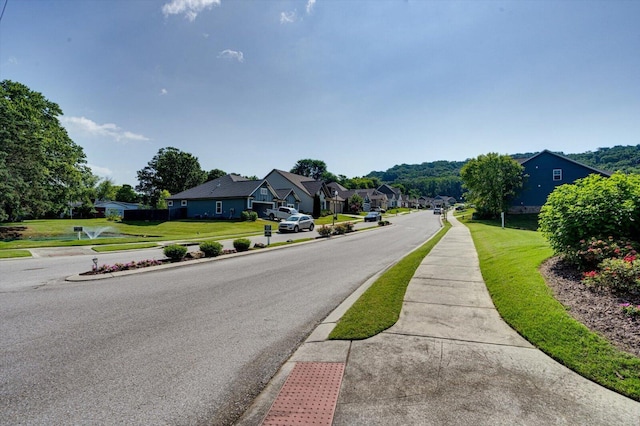 6022 Somerhaven Trl, Hixson, TN 37343 - view of asphalt road with sidewalks, curbs, and a residential view
