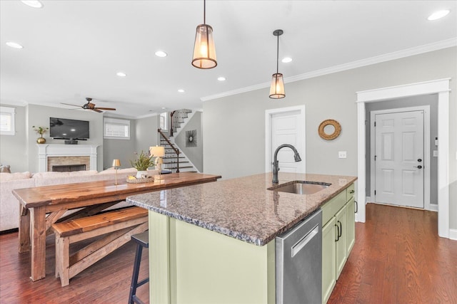6022 Somerhaven Trl, Hixson, TN 37343 - kitchen with green cabinetry, a sink, stainless steel dishwasher, ceiling fan, and a fireplace