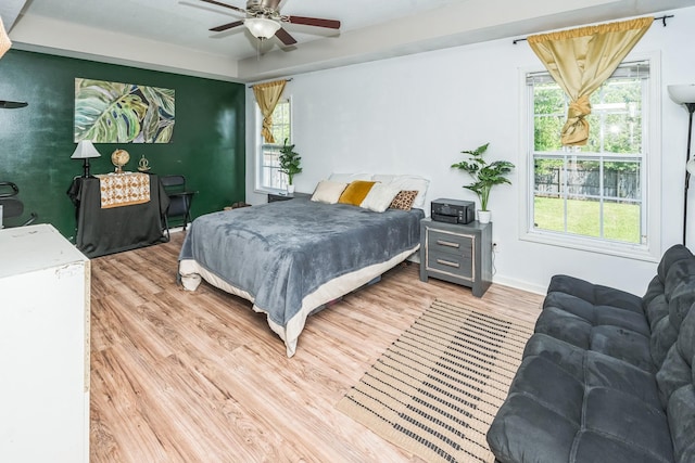 3689 Nadia Dr, Clarksville, TN 37040 - bedroom featuring light wood-style floors, multiple windows, and ceiling fan