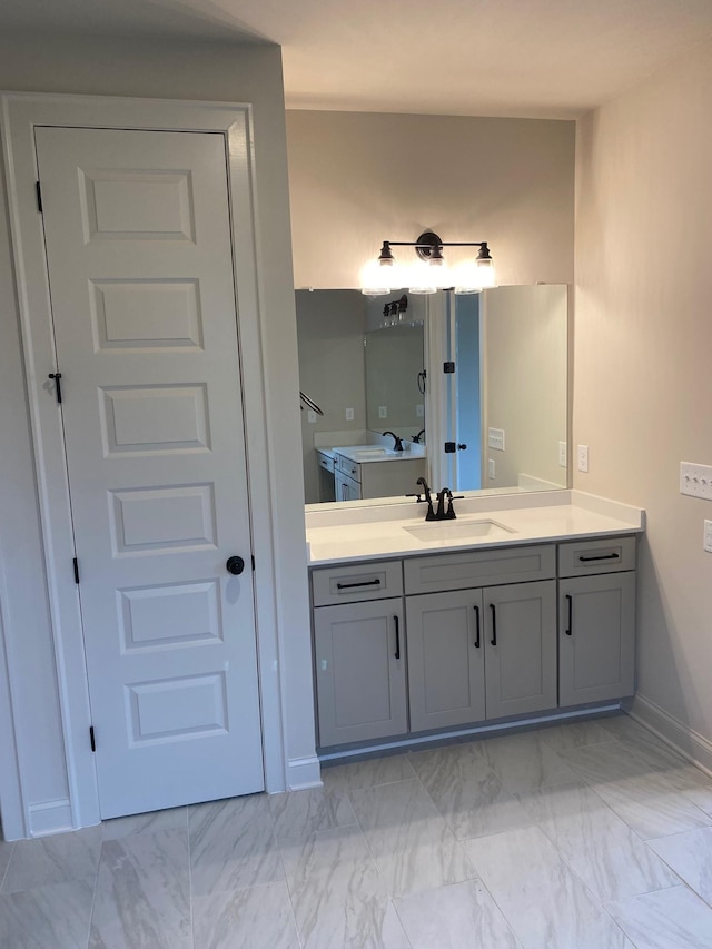 7321 Katherine Ct, Fairview, TN 37062 - bathroom with marble finish floors, vanity, and baseboards