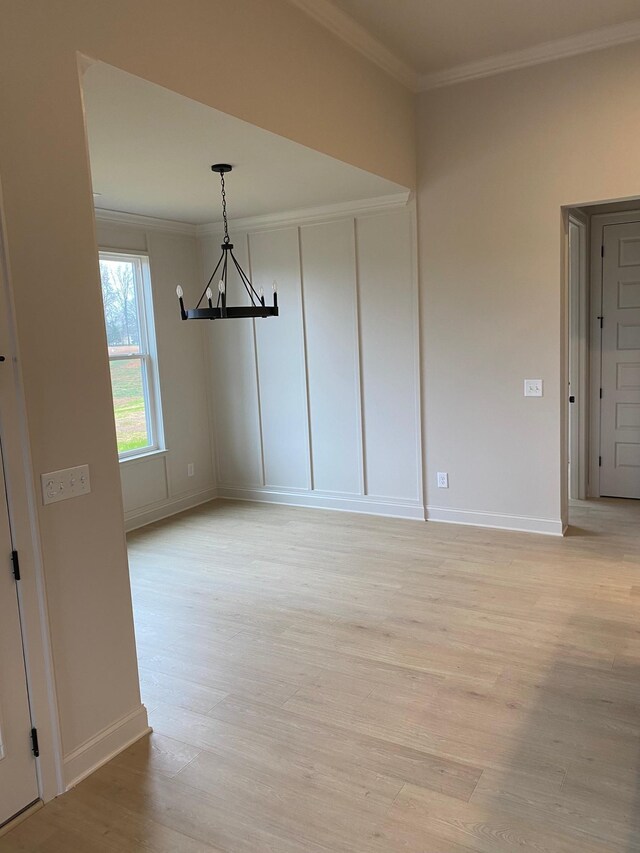 7321 Katherine Ct, Fairview, TN 37062 - spare room featuring a chandelier, light wood-style flooring, crown molding, and baseboards