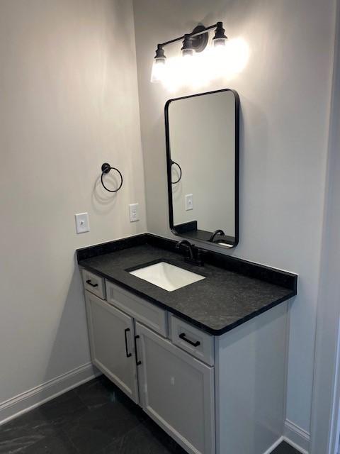 7317 Katherine Ct, Fairview, TN 37062 - bathroom with baseboards, vanity, and marble look tiles