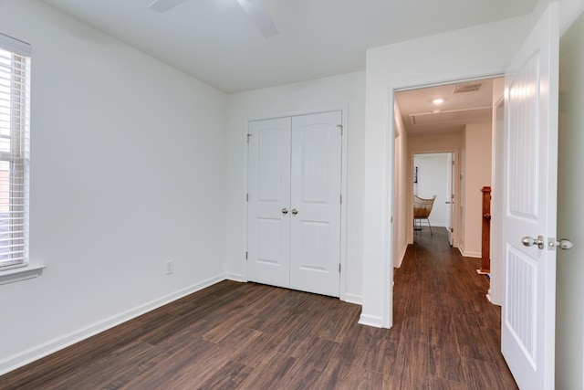 6233 Del Sol Dr, Whites Creek, TN 37189 - unfurnished bedroom with dark wood finished floors, a closet, baseboards, and multiple windows