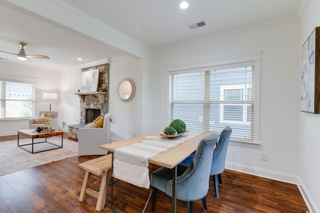 6233 Del Sol Dr, Whites Creek, TN 37189 - dining area featuring crown molding, dark wood finished floors, a ceiling fan, a fireplace, and baseboards
