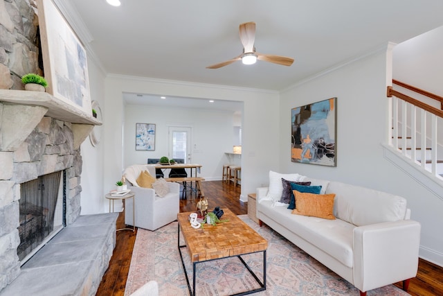 6233 Del Sol Dr, Whites Creek, TN 37189 - living area featuring wood finished floors, a ceiling fan, crown molding, a stone fireplace, and recessed lighting