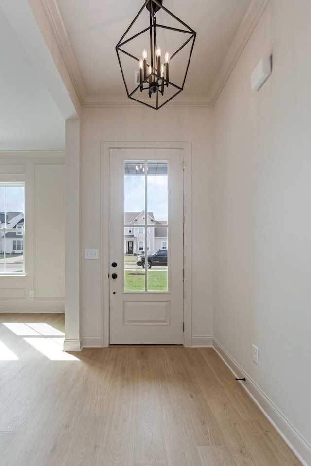 7406 Black Fox Dr, Fairview, TN 37062 - entryway with light wood-type flooring, a chandelier, crown molding, and baseboards