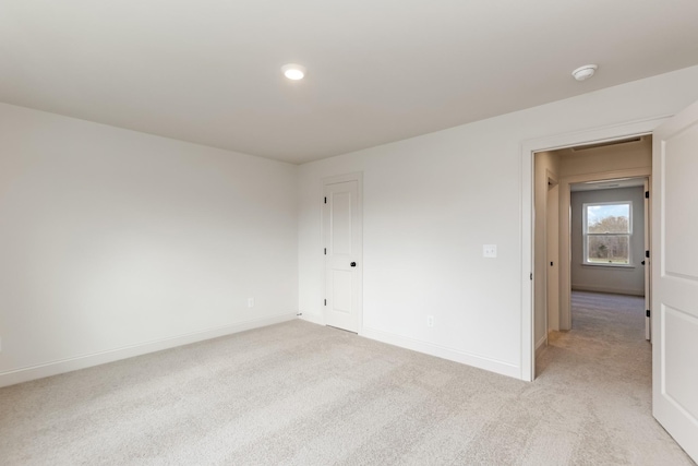 7406 Black Fox Dr, Fairview, TN 37062 - empty room featuring light carpet, baseboards, and a smoke detector