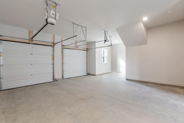 7406 Black Fox Dr, Fairview, TN 37062 - garage with a garage door opener, baseboards, and recessed lighting