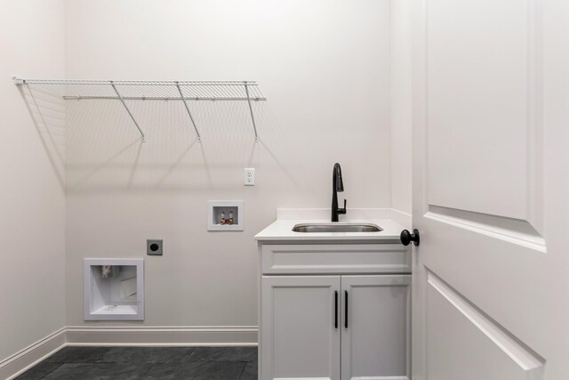7406 Black Fox Dr, Fairview, TN 37062 - laundry area with washer hookup, baseboards, electric dryer hookup, and cabinet space