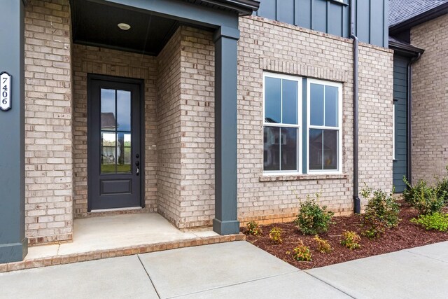 7406 Black Fox Dr, Fairview, TN 37062 - property entrance with board and batten siding and brick siding