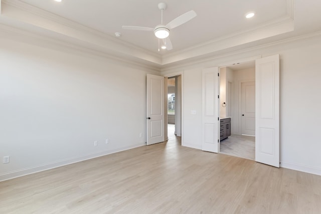 7406 Black Fox Dr, Fairview, TN 37062 - unfurnished bedroom with a tray ceiling, ornamental molding, light wood-style floors, recessed lighting, and baseboards
