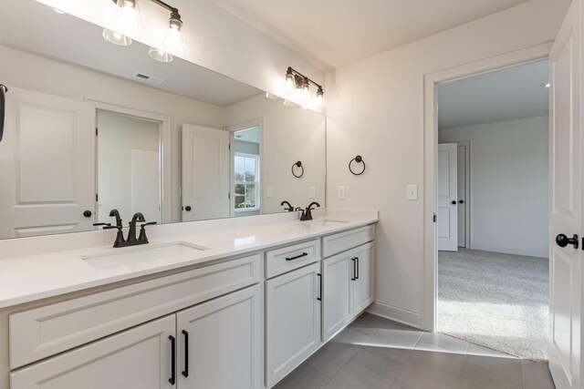7406 Black Fox Dr, Fairview, TN 37062 - bathroom featuring double vanity, tile patterned flooring, and baseboards