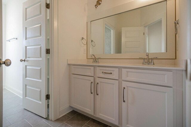 7413 Black Fox Dr, Fairview, TN 37062 - full bathroom with tile patterned floors, double vanity, and baseboards