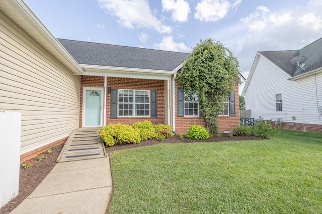 1905 Bugle Ct, Spring Hill, TN 37174 - property entrance featuring brick siding, a lawn, and a shingled roof