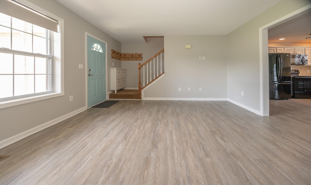 1905 Bugle Ct, Spring Hill, TN 37174 - unfurnished living room with stairway and wood finished floors