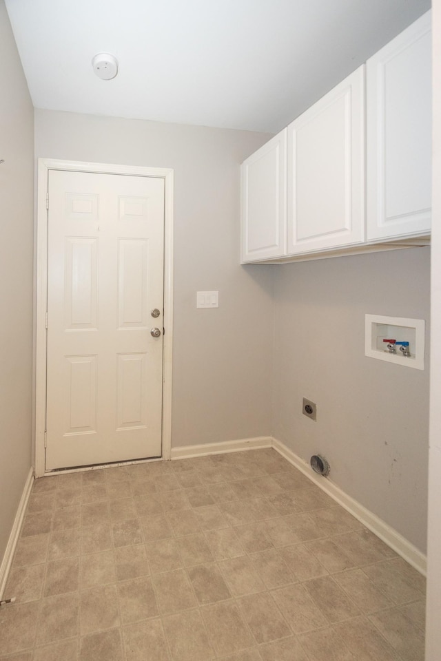 1905 Bugle Ct, Spring Hill, TN 37174 - laundry area featuring cabinet space, electric dryer hookup, hookup for a washing machine, and light flooring