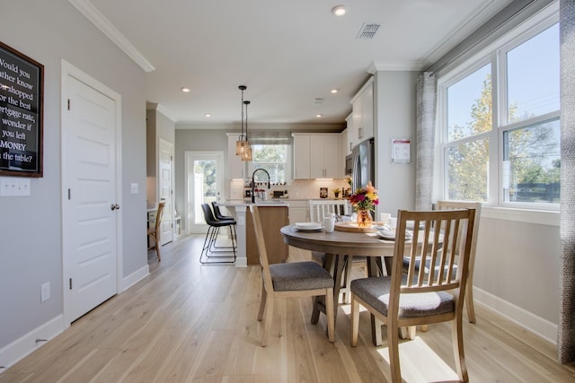 5220 Gladecress Ln NE, Hermitage, TN 37076 - dining space featuring ornamental molding, healthy amount of natural light, light wood finished floors, baseboards, and recessed lighting