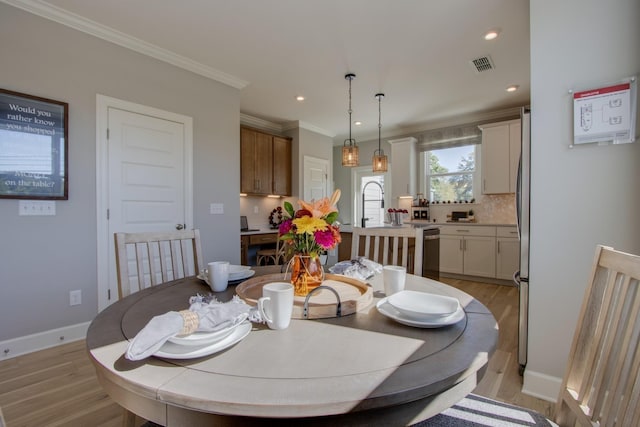 5220 Gladecress Ln NE, Hermitage, TN 37076 - dining area with light wood finished floors, recessed lighting, ornamental molding, and baseboards