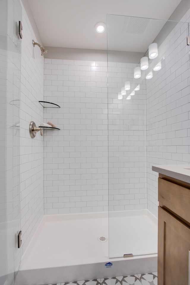5220 Gladecress Ln NE, Hermitage, TN 37076 - bathroom featuring tiled shower, vanity, and recessed lighting