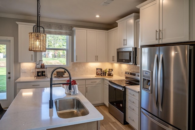 5220 Gladecress Ln NE, Hermitage, TN 37076 - kitchen featuring stainless steel appliances, a sink, light countertops, ornamental molding, and white cabinets