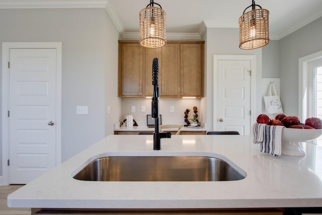 5220 Gladecress Ln NE, Hermitage, TN 37076 - kitchen with pendant lighting, crown molding, a sink, brown cabinetry, and light stone counters