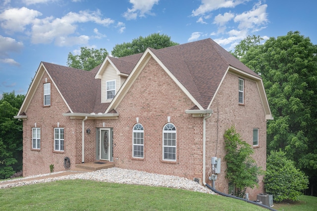 1245 Ben Hill Blvd, Nolensville, TN 37135 - traditional-style house with a shingled roof, central AC unit, and brick siding