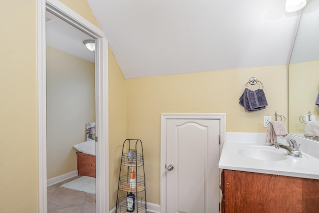 1245 Ben Hill Blvd, Nolensville, TN 37135 - bathroom with vanity, vaulted ceiling, and tile patterned floors
