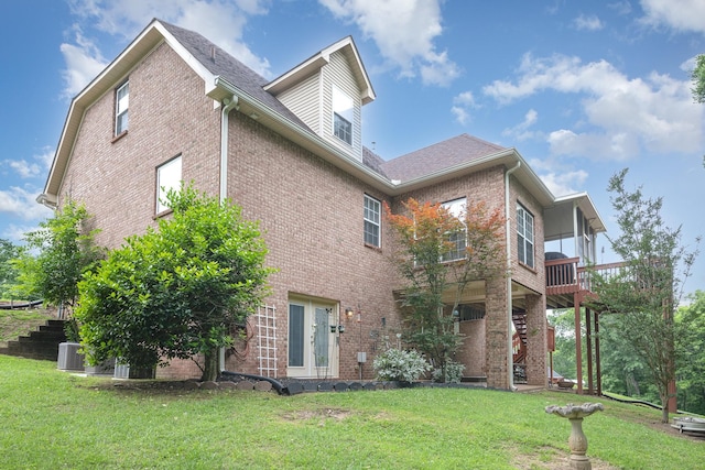 1245 Ben Hill Blvd, Nolensville, TN 37135 - rear view of property featuring brick siding, a yard, central AC unit, and roof with shingles