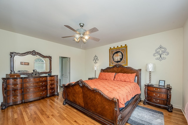 1245 Ben Hill Blvd, Nolensville, TN 37135 - bedroom with light wood-style floors, a ceiling fan, and baseboards