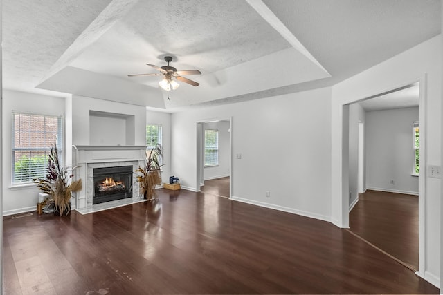 929 Chaparral Dr, Lebanon, TN 37087 - living room featuring a tray ceiling, a textured ceiling, wood finished floors, ceiling fan, and baseboards