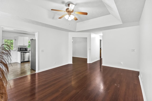 929 Chaparral Dr, Lebanon, TN 37087 - unfurnished room featuring a raised ceiling, a ceiling fan, dark wood-type flooring, and baseboards