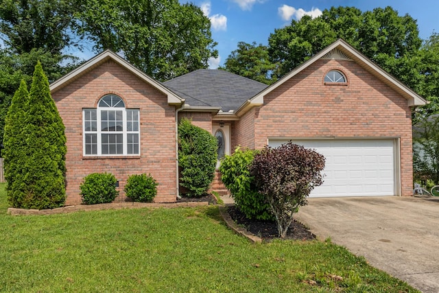 929 Chaparral Dr, Lebanon, TN 37087 - view of front of property featuring brick siding, concrete driveway, a front yard, and a garage